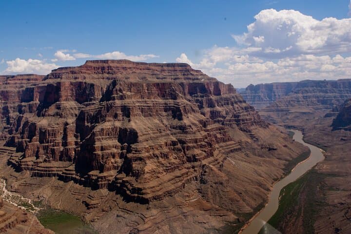 Fly over the edge of the Grand Canyon and descend below the Rim